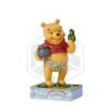 ENESCO: Pooh With Clovers and Pot Gold Figurine